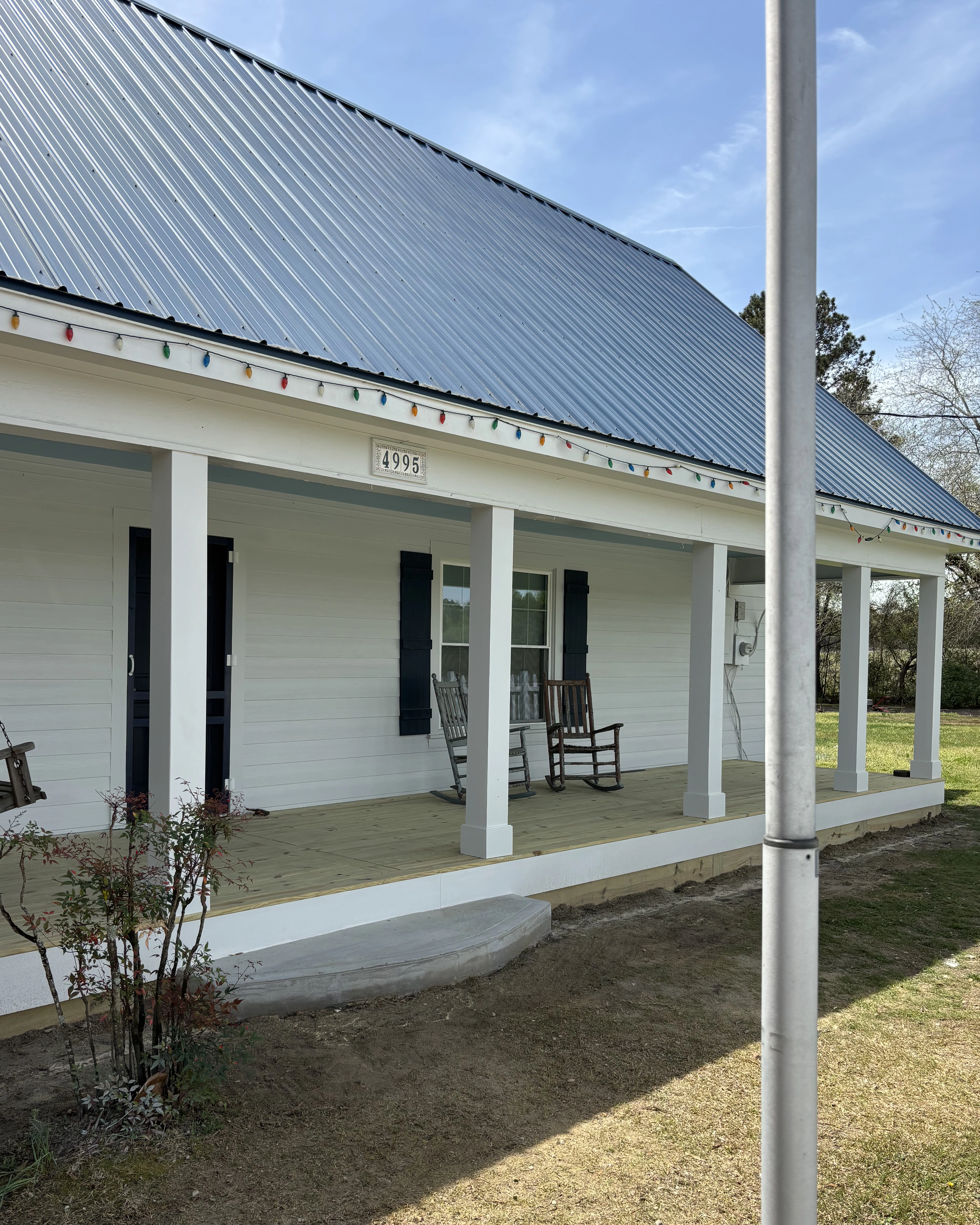 Exterior Farmhouse with Rockig Chairs